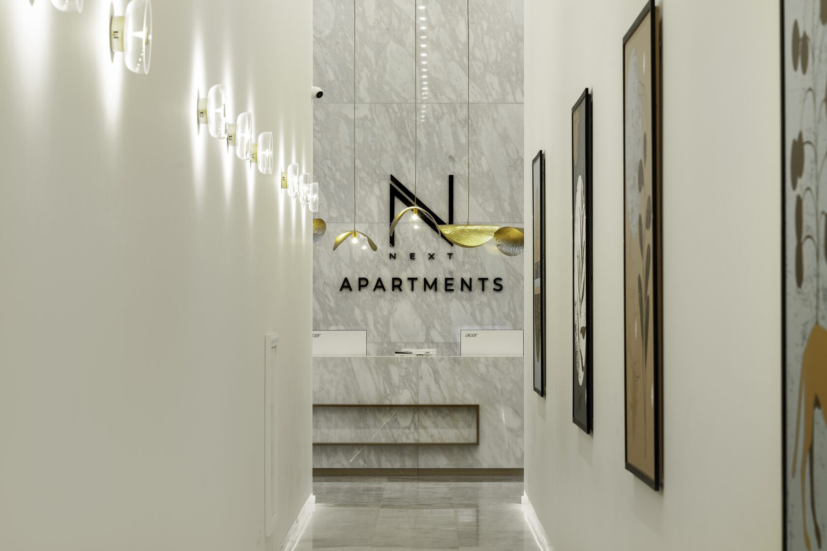 NEXT Apartments reception detail and hotel signage